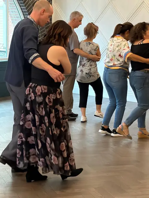Dancers in close hold during the lesson at Tuesday Salsa Nights, The Grand Hall, Chilliwack BC