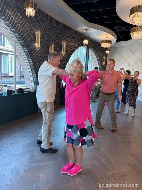A dancer mid-turn by the arched windows at The Grand Hall, District 1881