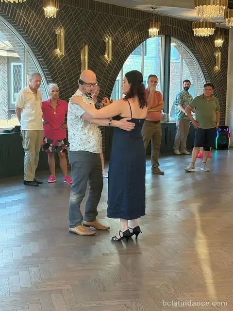 Several couples dancing by the arched windows at Tuesday Salsa Nights, The Grand Hall, District 1881