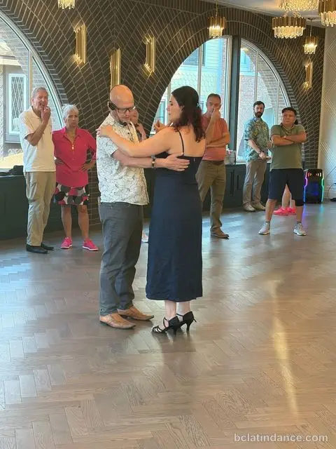 Salsa Paul dancing with Paris, demonstrating the close hold during the Salsa lesson at Tuesday Salsa Nights, The Grand Hall, Chilliwack