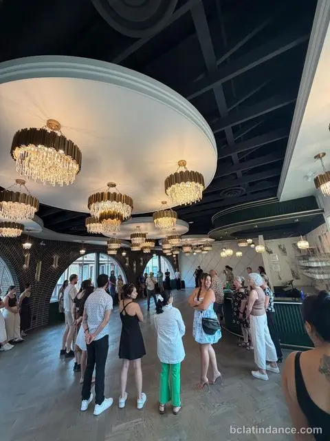The room filling up beneath the chandeliers before class at Tuesday Salsa Nights, The Grand Hall, District 1881, Chilliwack