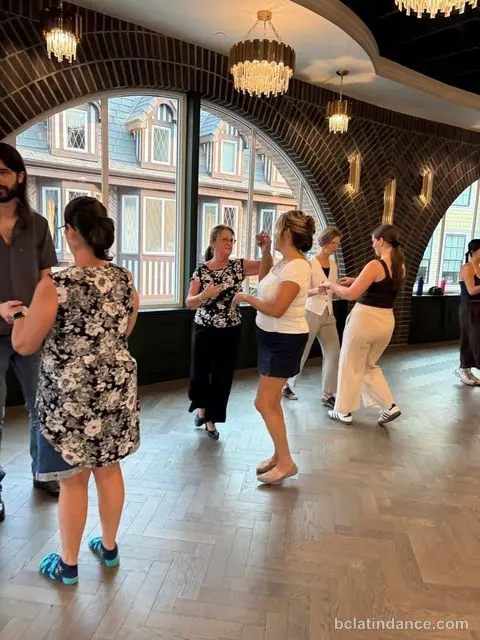 The class practising in loose formation by the arched windows at The Grand Hall, Chilliwack