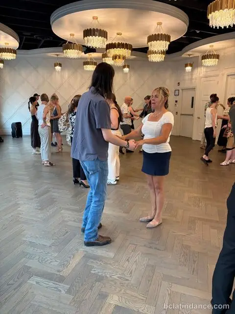 A couple joining hands to start the basic step at The Grand Hall, District 1881, Chilliwack