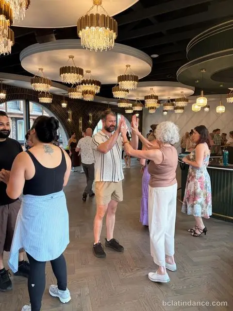 Two dancers practising the hand connection during the lesson at The Grand Hall, District 1881, Chilliwack