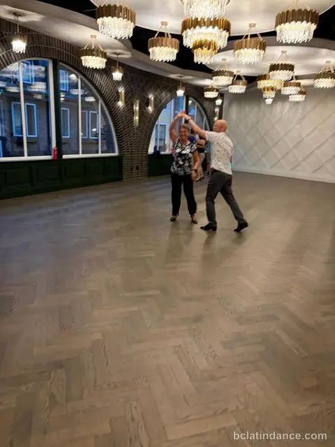 A couple turning on an emptying floor late in the social at The Grand Hall, Chilliwack