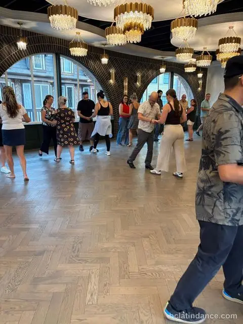 The class scattered across the floor by the arches at Tuesday Salsa Nights, The Grand Hall, Chilliwack