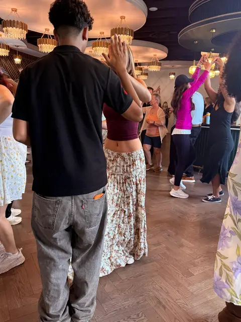 Partners clapping the timing through the beginner lesson at Tuesday Salsa Nights