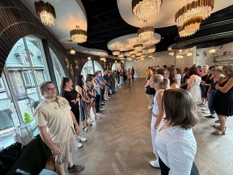Beginner salsa lesson lined up across the floor at The Grand Hall, Chilliwack