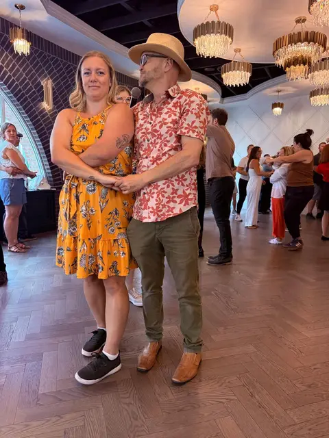 Partners in close hold during the social dance hour at The Grand Hall