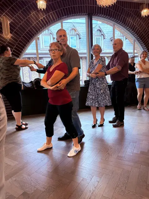 Couples dancing by the arched windows at The Grand Hall, District 1881