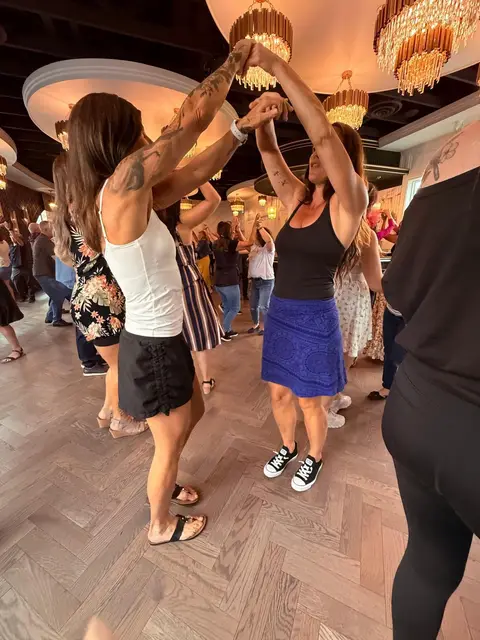 Two dancers turning together on the floor at The Grand Hall, Chilliwack