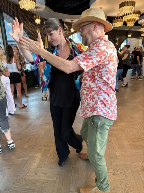 A cross body lead on the salsa floor at Tuesday Salsa Nights, The Grand Hall, Chilliwack