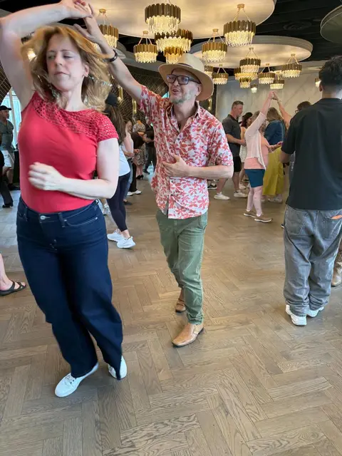 Salsa Paul sending a partner into a turn at Tuesday Salsa Nights, District 1881