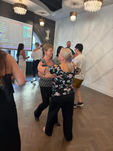 Dancing in front of the night’s playlist screen at Tuesday Salsa Nights, The Grand Hall