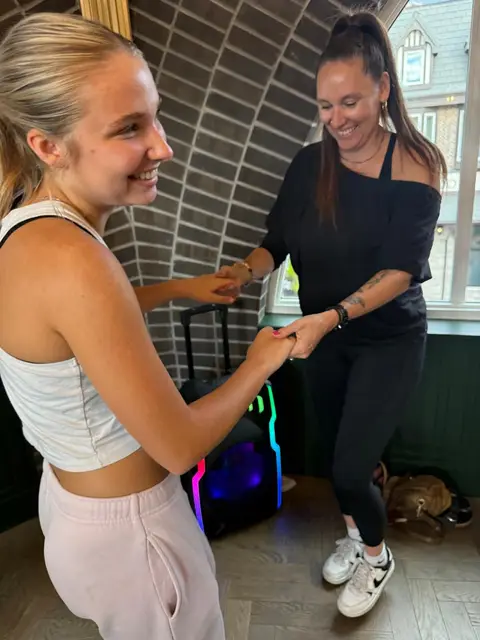 Learning the hand connection at the beginner salsa lesson, The Grand Hall, Chilliwack