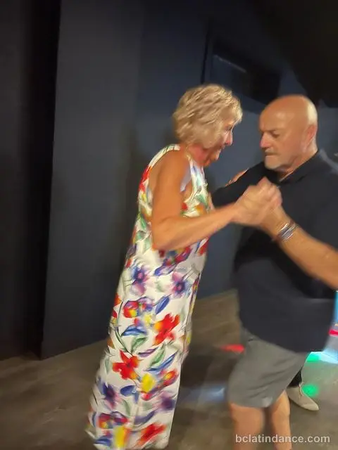 A couple dancing close hold during the social at Friday Salsa Night, Spencer Studios, Chilliwack